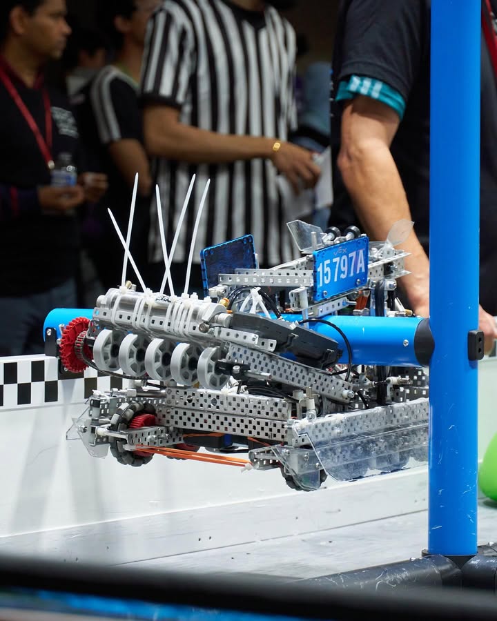 The 15797A Over Under robot hanging from the elevation bar at a NorCal event